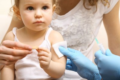 Baby girl being vaccinated