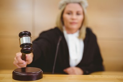 blonde judge with gavel
