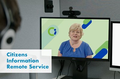 Citizens information Officer speaks remotely to client in private booth
