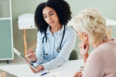 Doctor talks with patient