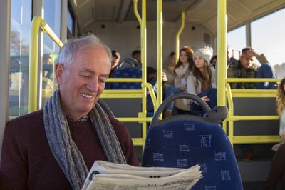 Man reading on bus