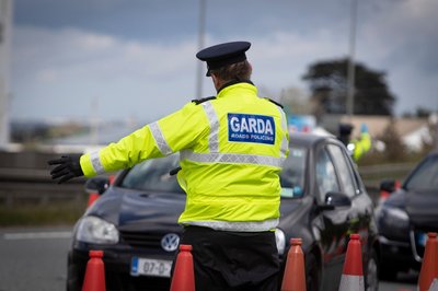 Garda stopping a car at the roadside