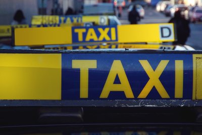taxi sign on car