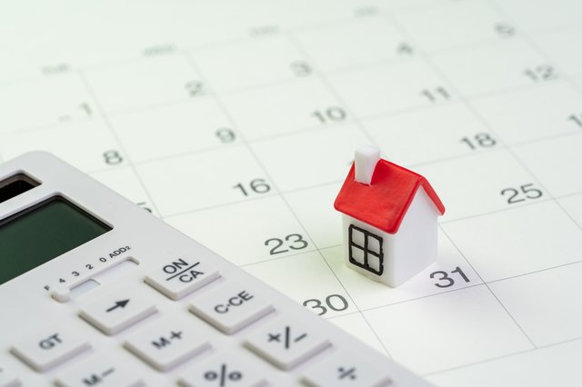 Toy house with a calendar and calculator