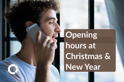 Young man on his mobile phone looks out the window. Text reads: "Opening hours at Christmas & New Year!"