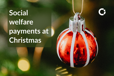 Red Christmas tree bauble with green background. Text reads: "Social welfare payments at Christmas"