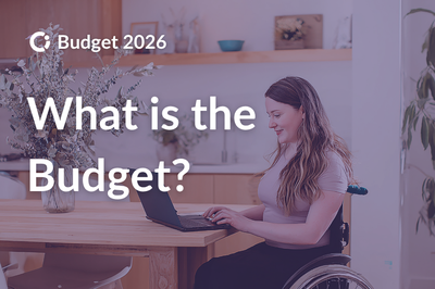 Woman sitting in a wheelchair at her kitchen table. Text reads “What is the Budget?”