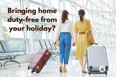 2 passengers pull their luggage at the airport. Text reads "Bringing home duty-free from your holiday".