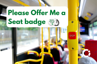 Interior of bus. Text reads "'Please Offer Me a Seat' badge"