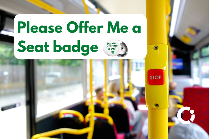 Interior of bus. Text reads "'Please Offer Me a Seat' badge"