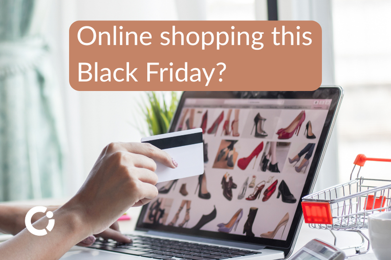 Woman's hand holding a credit card while she looks at shopping offers on her laptop. Text reads "Online shopping this Black Friday?"