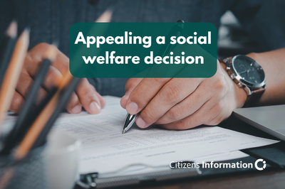 Appealing a social welfare decision. Hand filling in a form at a desk.